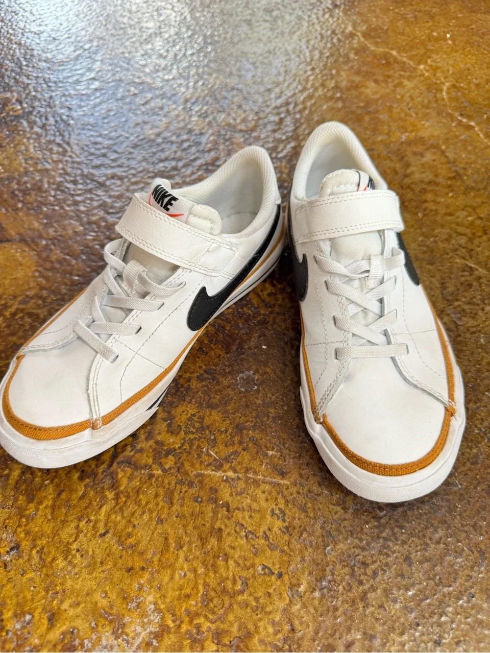 Nike Kids White Sneakers with Black Swoosh and Brown Trim